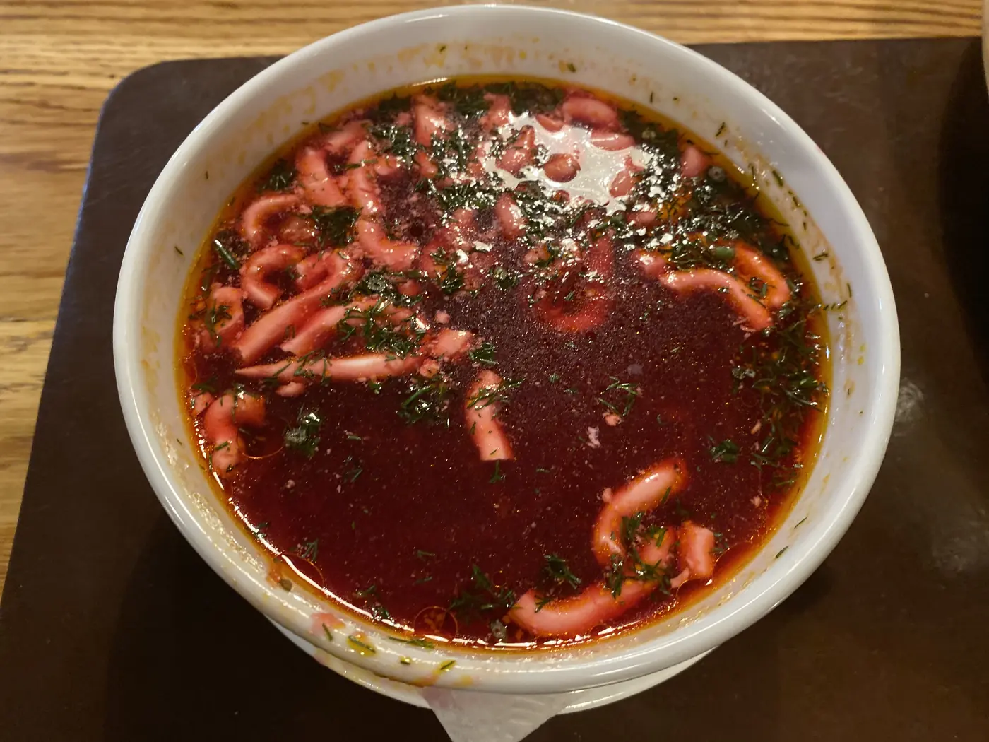 A bowl of Belarusian borscht with sour cream