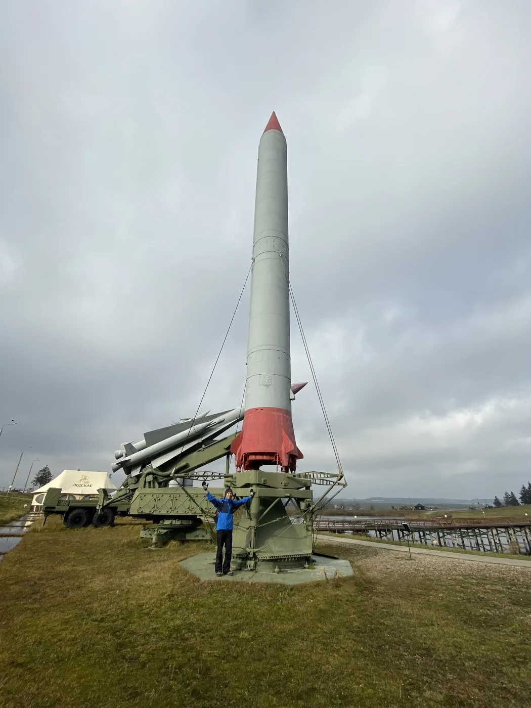 A white missile with a red tip on its launcher at the Stalin Line museum