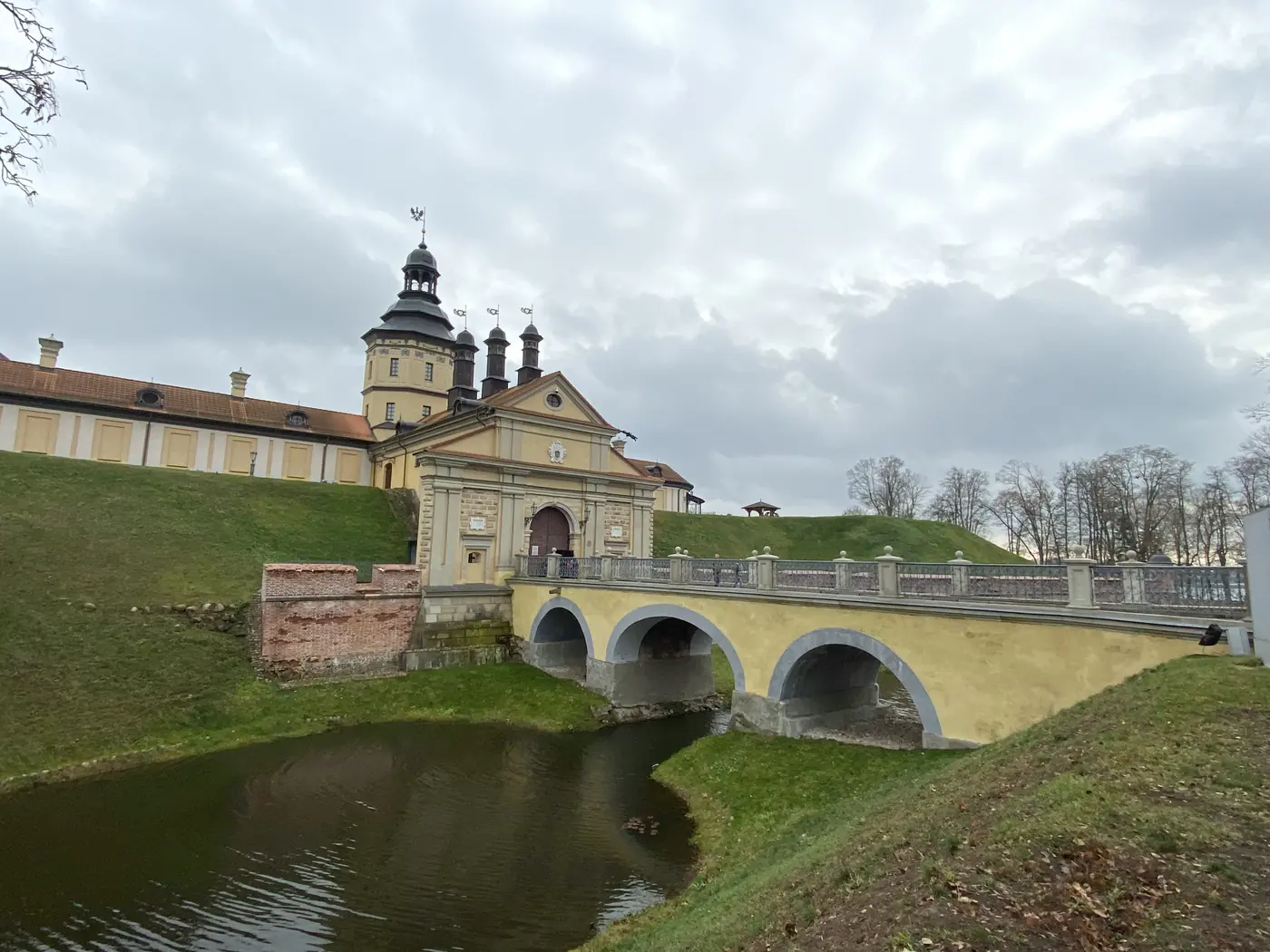 Nesvizh Castle behind its moat and arched bridge