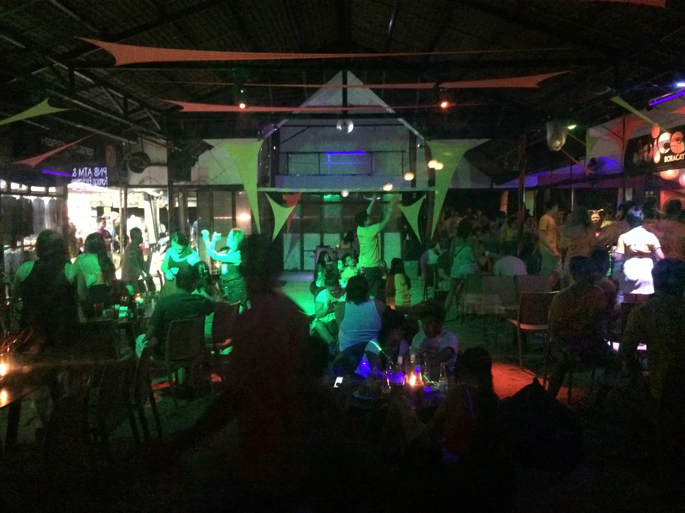 A packed open-air bar on the pub crawl night