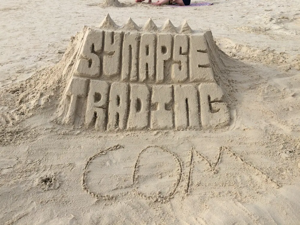 A sandcastle spelling Synapse Trading .com