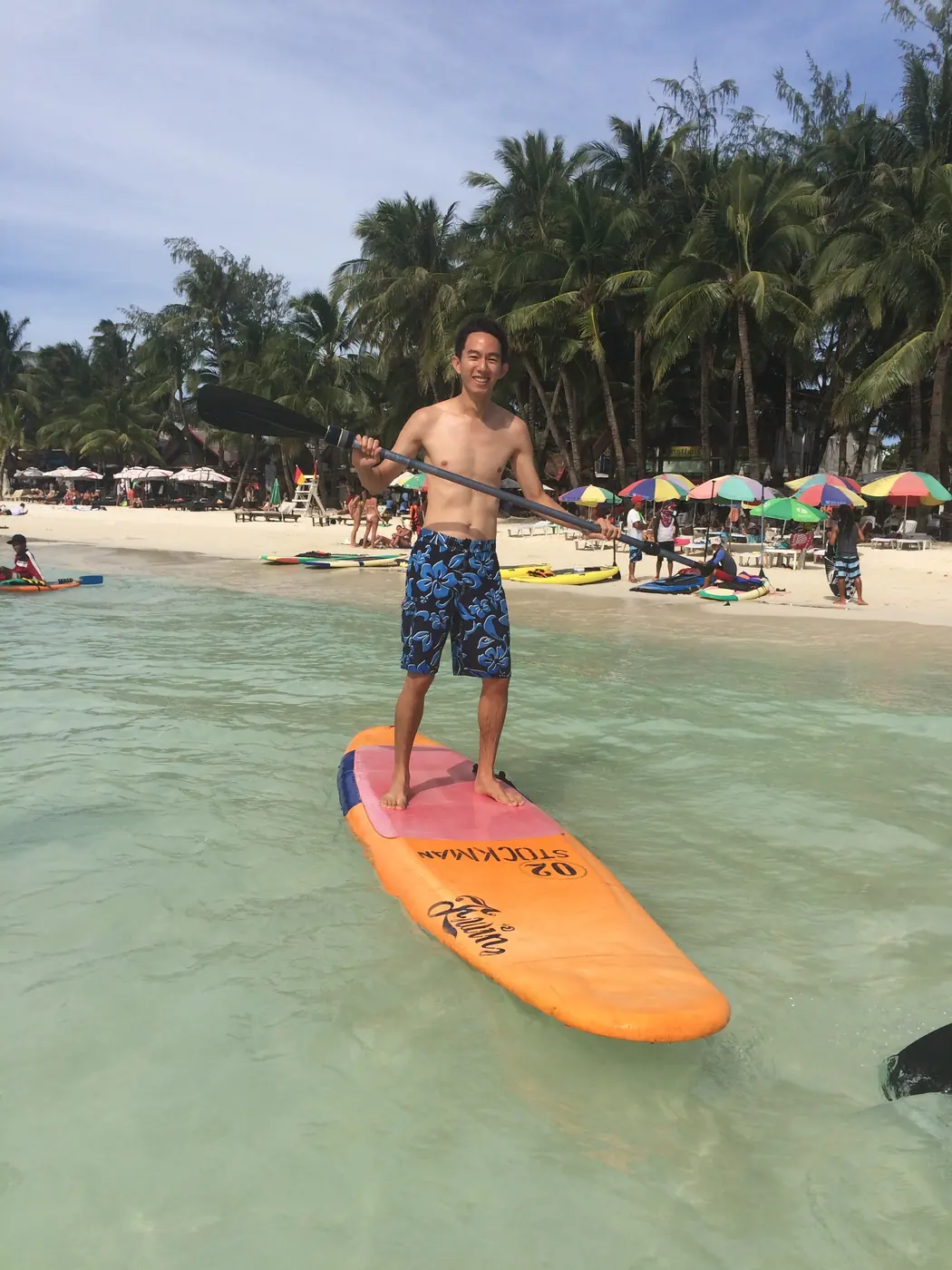 Stand-up paddleboarding in the shallows off White Beach
