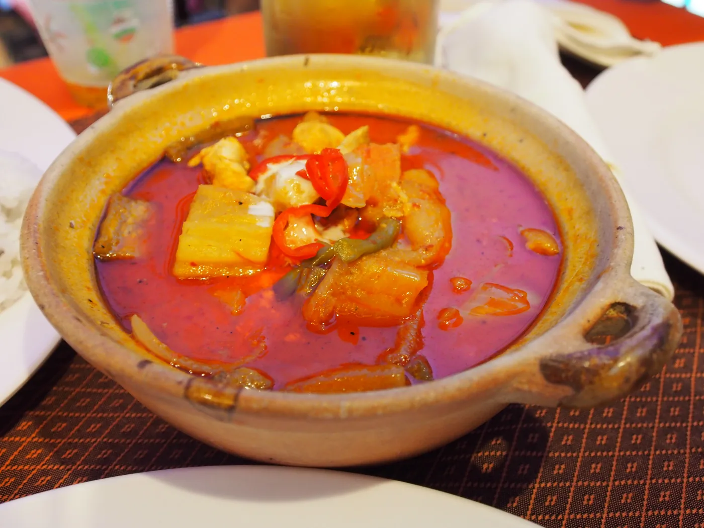 A Cambodian red curry in a clay pot