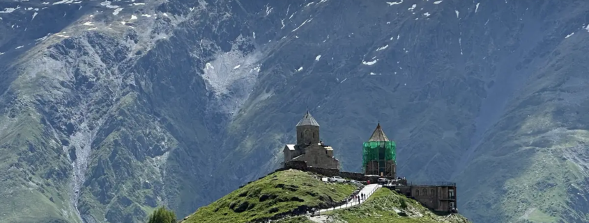 Gergeti Trinity Church on its ridge below the Caucasus mountains near Kazbegi, Georgia