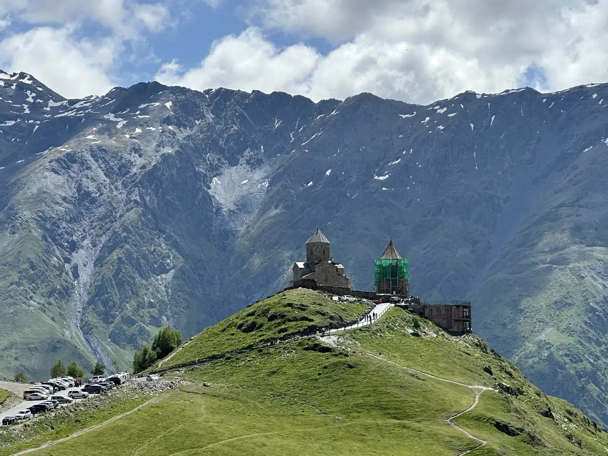 Gergeti Trinity Church on its ridge below the Caucasus mountains near Kazbegi, Georgia