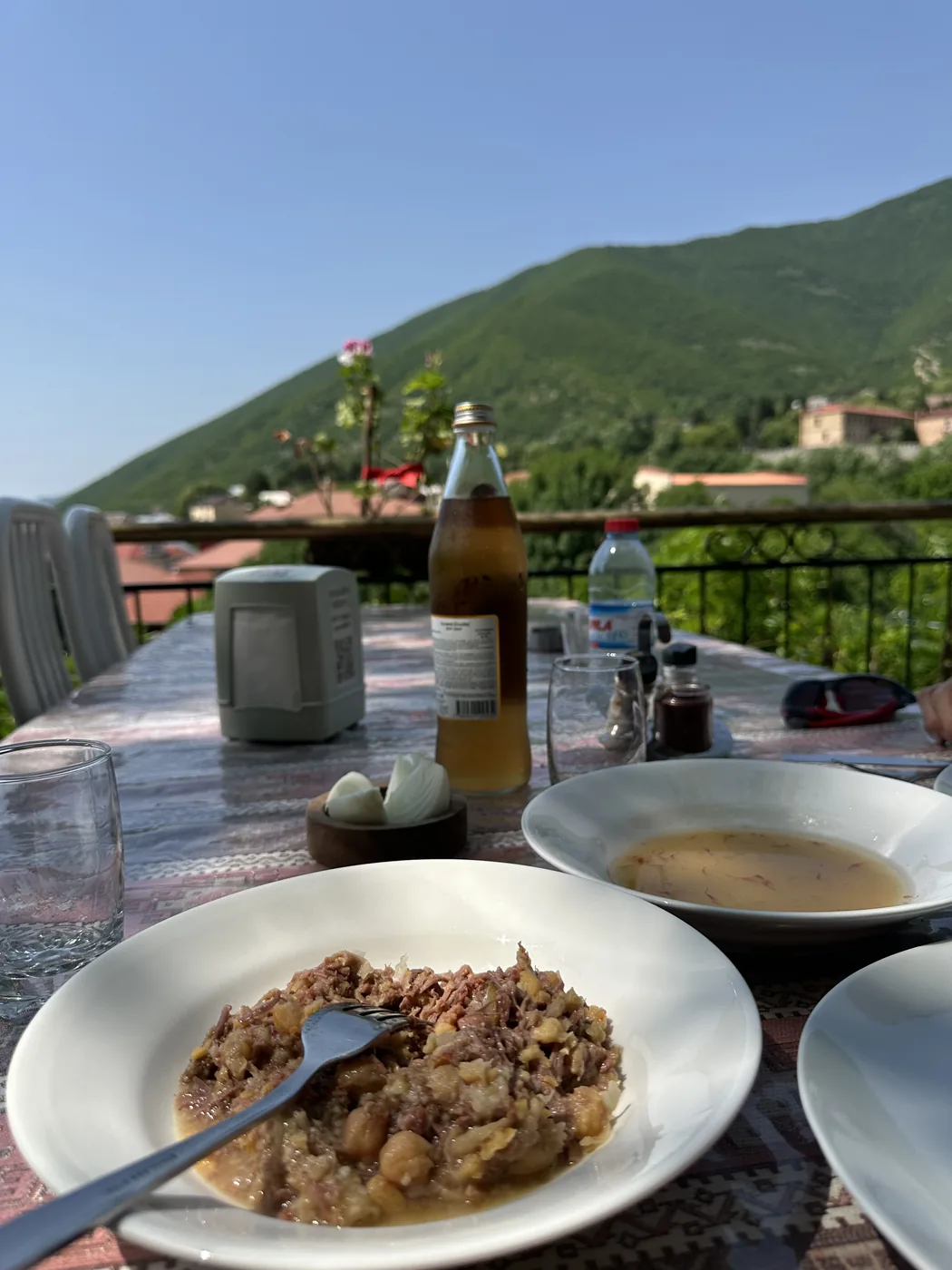 Sheki piti, lamb and chickpea stew with its broth in a separate bowl