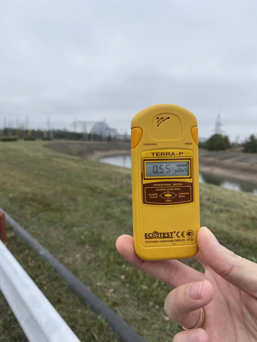 A dosimeter reading 0.55 microsieverts an hour across the cooling canal from Reactor 4