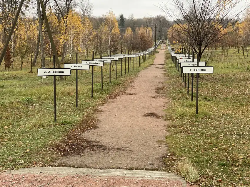 An avenue of signs for the evacuated villages, Chernobyl town