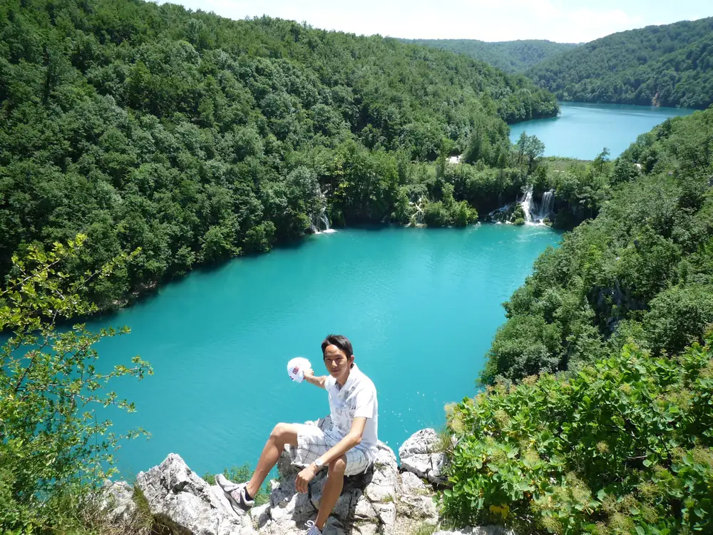 Spencer above a turquoise lake at Plitvice