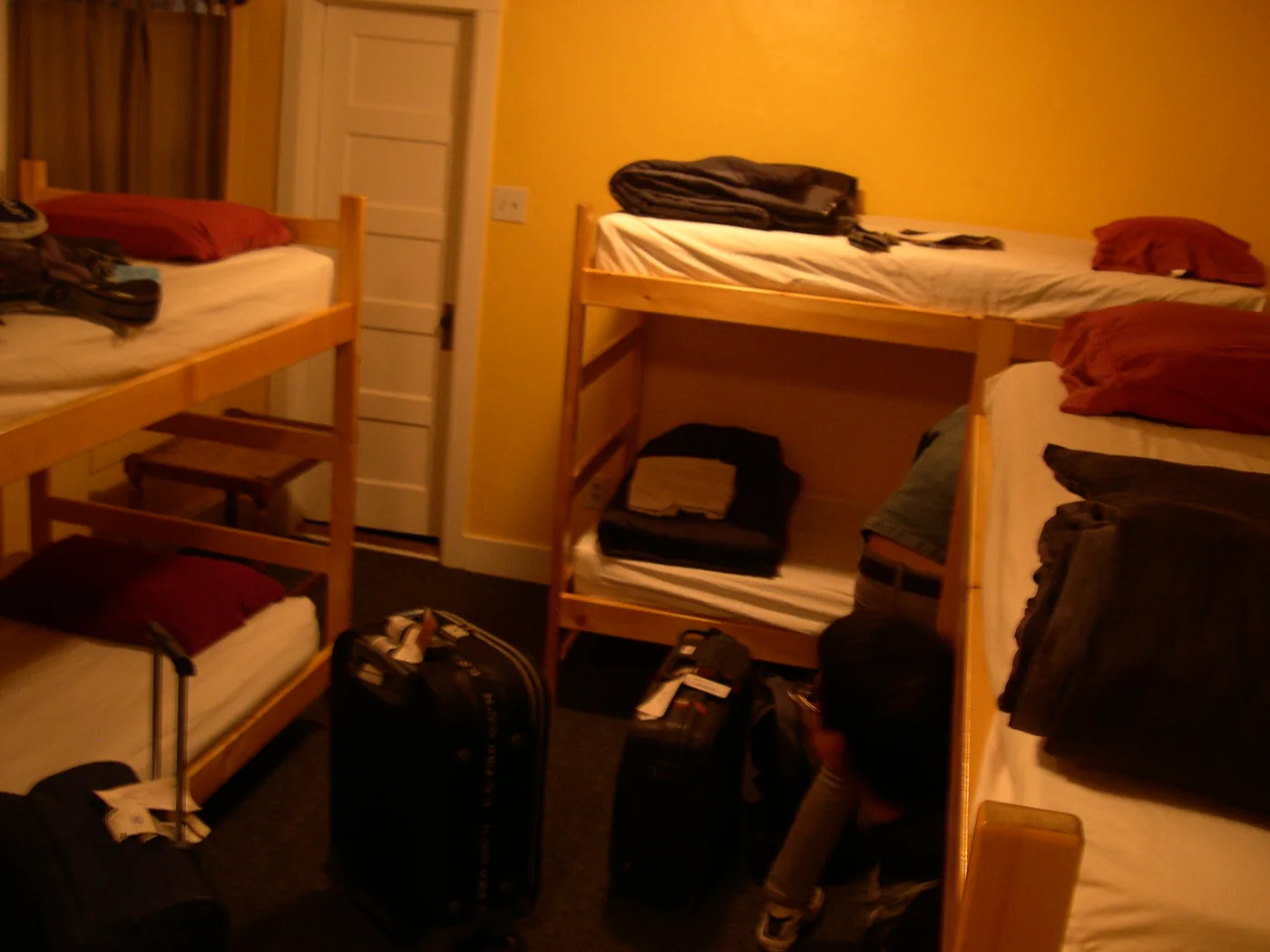The Flagstaff hostel bunk room with suitcases