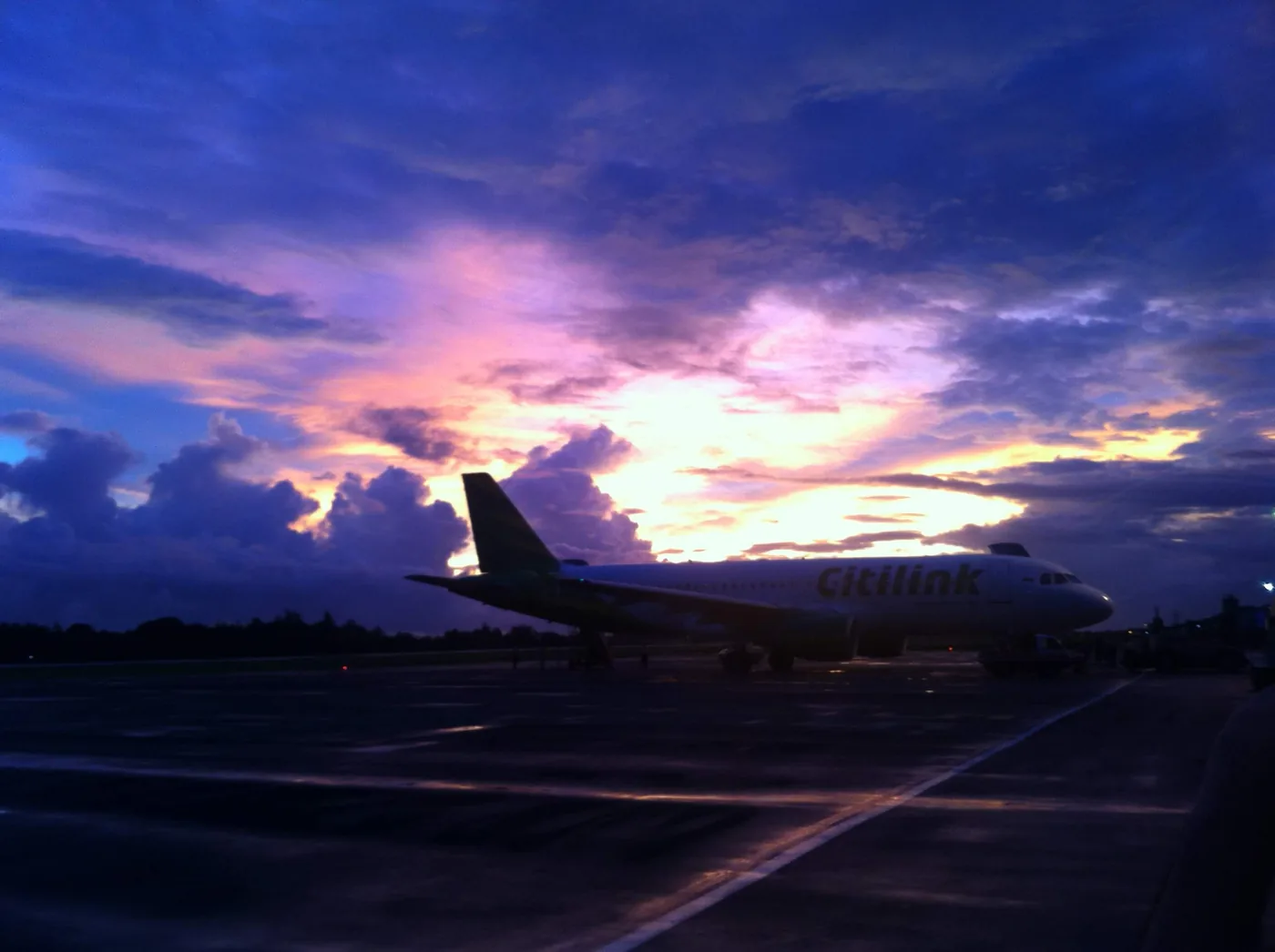 A sunset over the runway on the way home