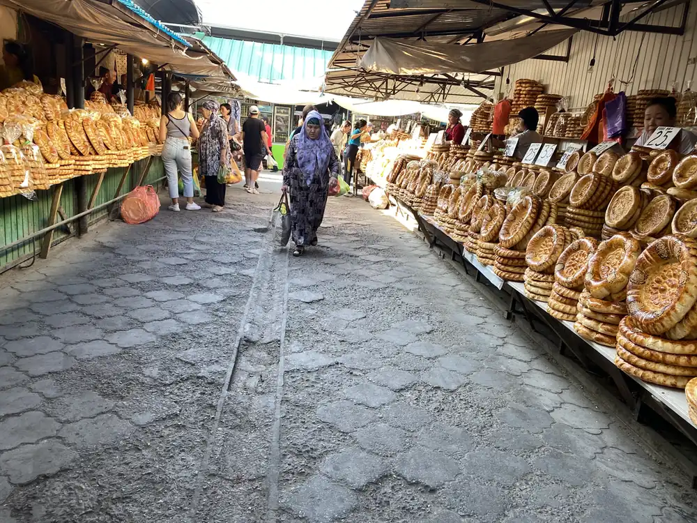 Rows of round bread loaves at the Osh Bazaar in Bishkek