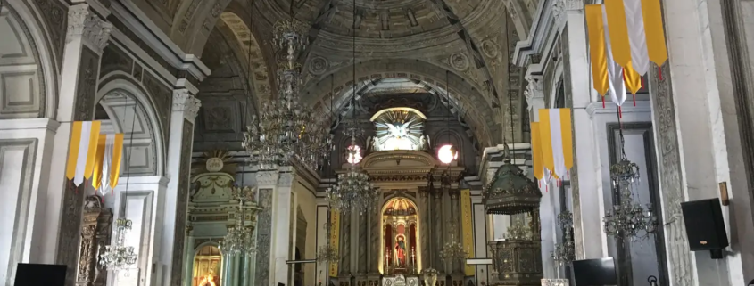 San Agustin Church, the nave and the gilded altar