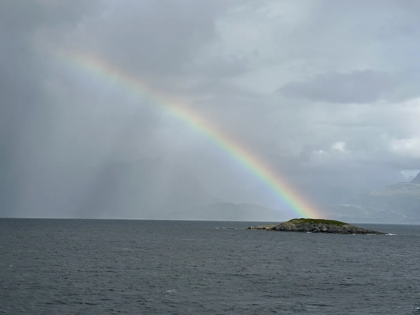 A rainbow over a skerry, from the deck