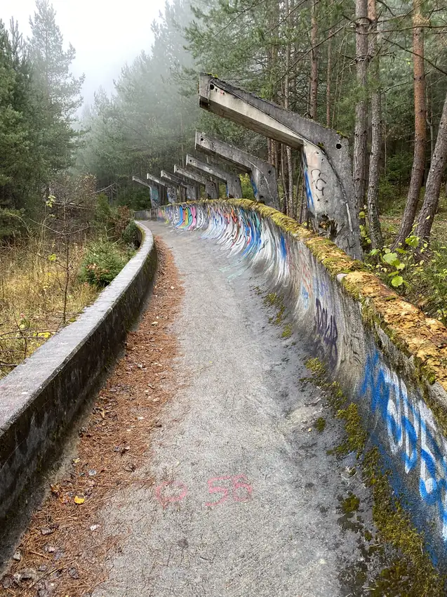 A banked graffiti-covered curve of the Sarajevo bobsleigh track