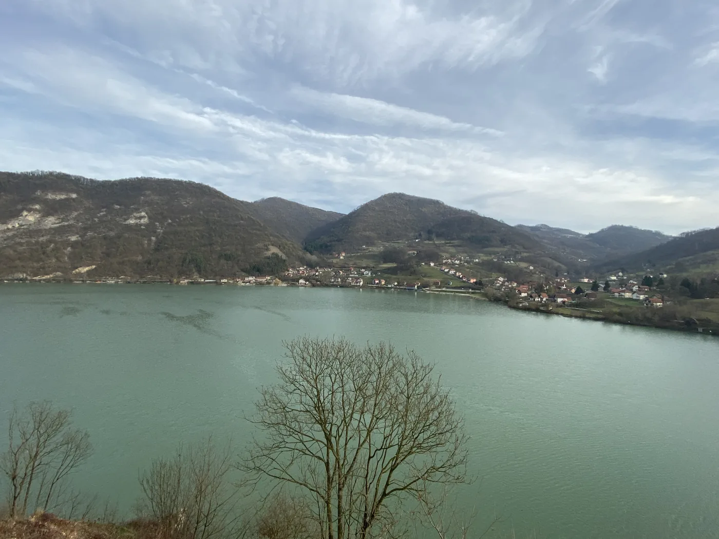 A long green reservoir between wooded hills on the road into Bosnia and Herzegovina