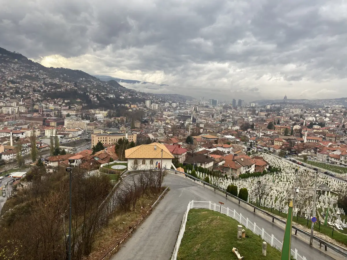 Red roofs across the Sarajevo valley seen from the hillside