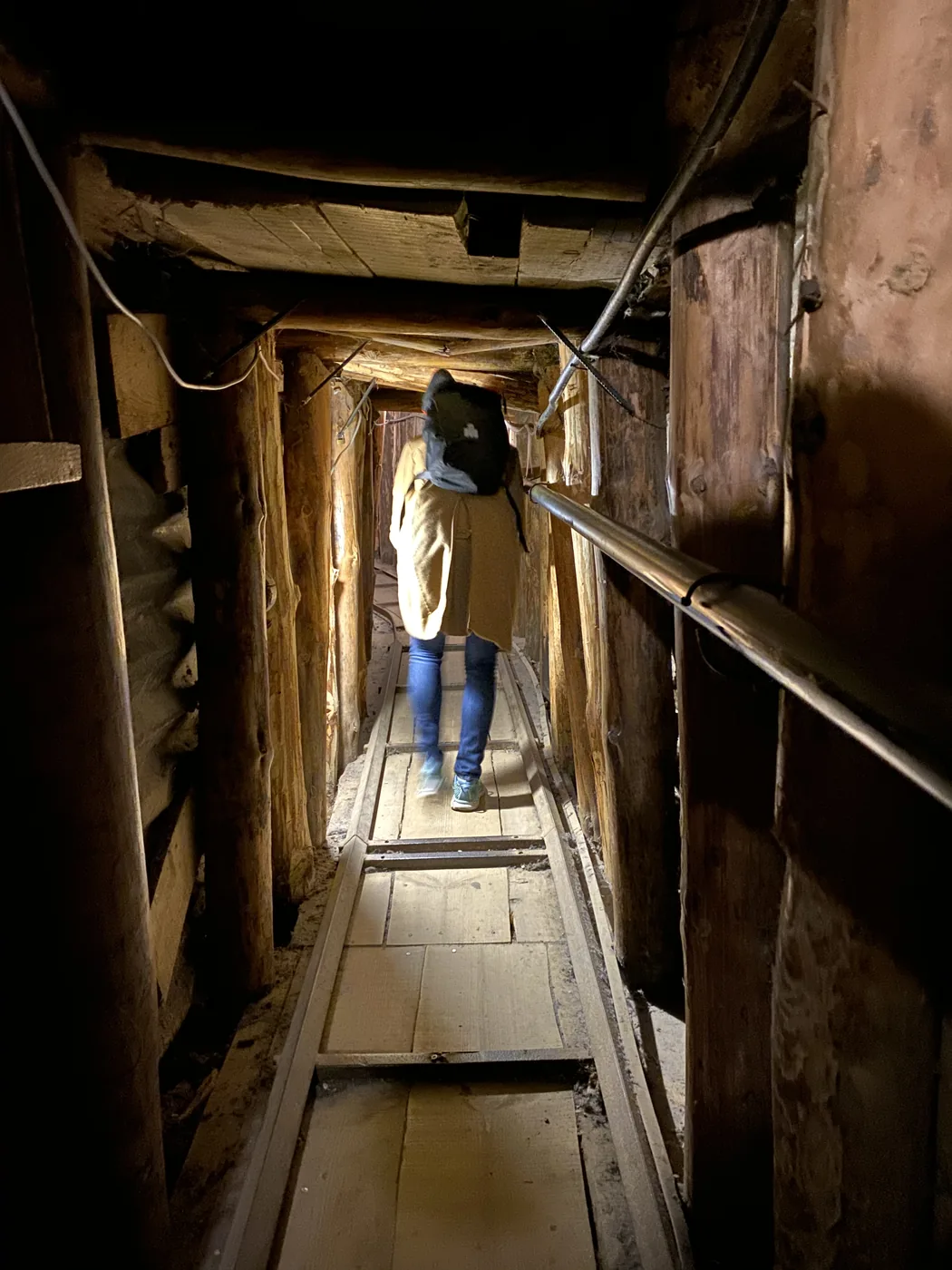 The low, timber-lined passage of the Sarajevo siege tunnel