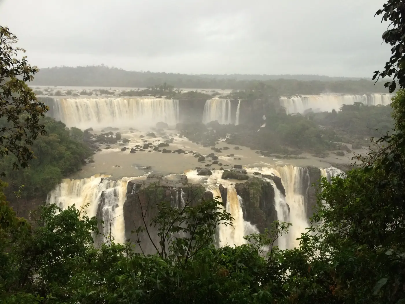 A line of Iguazu's falls framed by jungle, from the Brazilian side