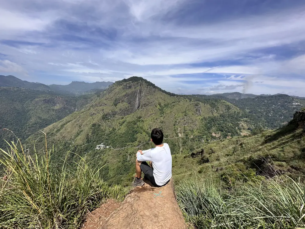 A hiker on Little Adam's Peak