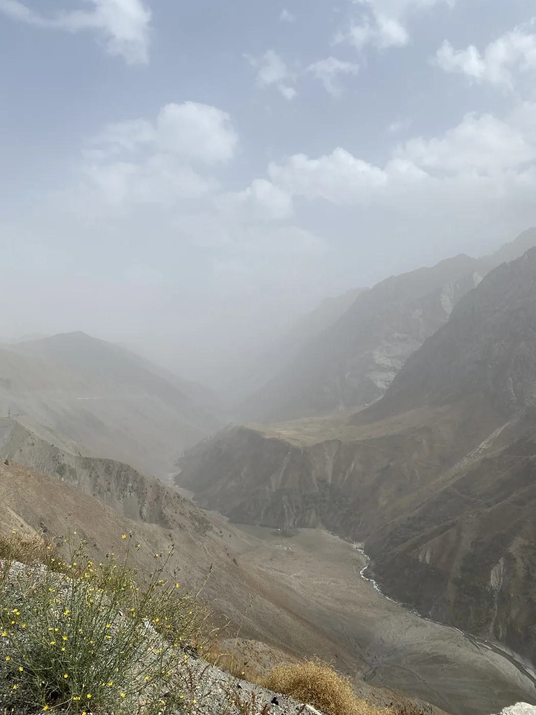 A deep hazy gorge on the road north from Dushanbe into the Fann Mountains