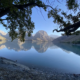 Iskanderkul lake reflecting the Fann Mountains in still water, Tajikistan