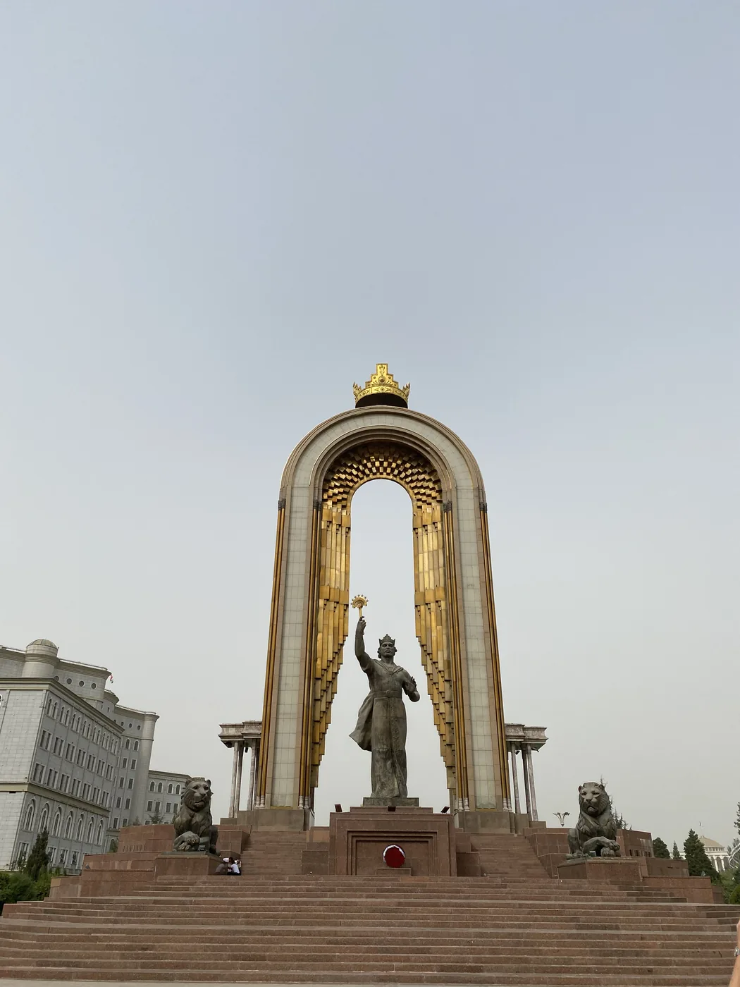The Ismoil Somoni monument under its gilded arch on Dousti Square, Dushanbe
